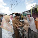 Wali Kota Asripan Nani Bersama Ketua TP-PKK Kotamobagu Hadiri Hari Raya Ketupat di Desa Moyag Todulan
