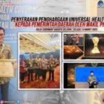 Bupati Joune Ganda Dan Wakil Bupati Kevin Lotulung Terima Penghargaan UHC dari Wakil Presiden RI
