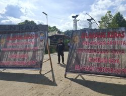 Polres Minahasa Tenggara Pasang Baliho Himbauan dan Larangan Pertambangan Ilegal di Ratatotok