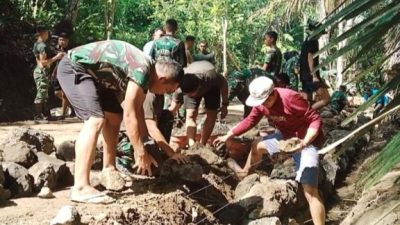 Satgas TMMD ke-128 Kodim 1302/Minahasa Kebut Pengecoran Talut Jalan di Watuliney
