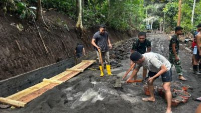Satgas TMMD Ke-128 Kodim 1302/Minahasa Genjot Pengerasan Jalan dan Pemasangan Talud di Watuliney