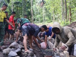 Satgas TMMD ke-128 Kodim 1302/Minahasa Bangun Jalan Diperkeras di Desa Watuliney